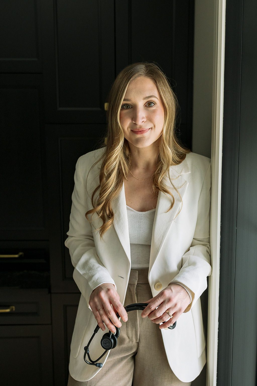 Person in blue shirt removing a pink face mask, with a cloudy sky background